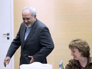 وزير الخارجية الايراني محمد جواد ظريف ووزيرة خارجية الاتحاد الاوروبي كاثرين اشتون/أ.ف.ب