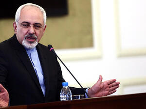 Iran's foreign minister issued a series of tweets late Thursday that protested US State Department's assertion that sanctions will be removed "in phases." (AFP/Behrouz Mehri)