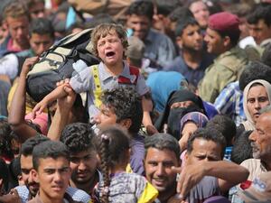 تعكف الأمم المتحدة في محيط الموصل، على أكبر عملية إغاثة هذا العام - أرشيف