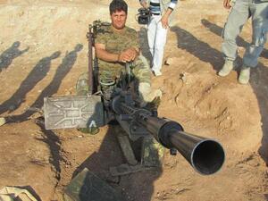 عنصر بشمركة على مدفع مضاد للطيران/أ.ف.ب