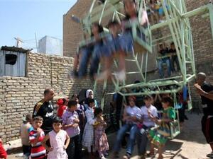 اطفال عراقيون يحتفلون خلال عيد الفطر/أ.ف.ب