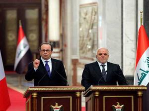 الرئيس الفرنسي فرانسوا أولاند ورئيس الوزراء العراقي حيدر العبادي