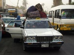 عائلة عراقية لاجئة بعد عودتها الى بغداد قادمة من دمشق
