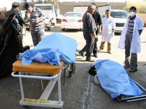 جثث لبعض ضحايا تفجير قنبلة امام مستشفى في تكريت 
