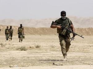 مقاتلون من تنظيم عصائب أهل الحق الشيعي في جنوب العراق
