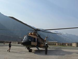 An Mi-17 military helicopter, like the one pictured here, killed nine people when it crashed south of Baghdad on Tuesday. (AFP/File)