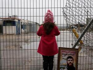 A Palestinian girl stands outside an Israeli jail. (AFP/File Photo)