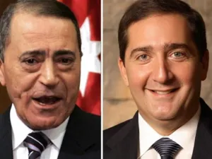 رئيس الوزراء المقال، سمير الرفاعي، ورئيس الوزراء المعين معروف البخيت/أ.ف.ب