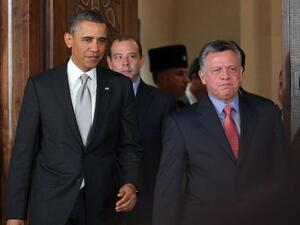 President Obama and King Abdullah arrive at a press conference (AFP Photo)