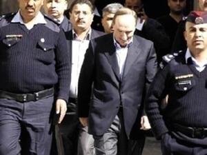 الذهبي برفقة رجال الامن خلال المحاكمة/أرشيف