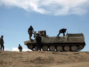 Fighters from the Syrian Democratic Forces (SDF) sit atop an armored personnel carrier in the northeastern Syrian province of Hasakeh, on February 19, 2016. (AFP/Delil Souleiman)
