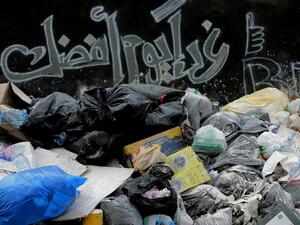 Beirut residents hope that "Tomorrow is a better day" in terms of their waste collection. (AFP/Joseph Eid)