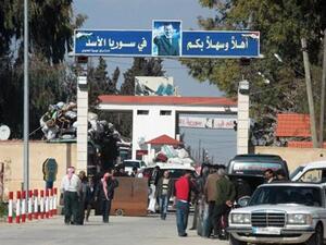 Syrians crossing into Lebanon on March 22 (Daily Star/ Nidal Solh)