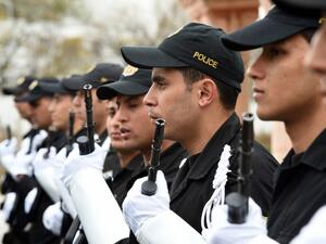 Tunisian police stand in line during a press conference held by Tunisia's Interior Minister Mohamed Gharsalli on March 26, 2015 in Tunis. (AFP/File)