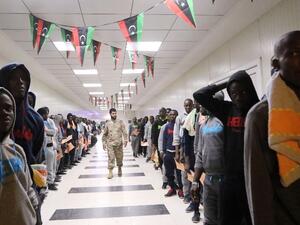 Migrants wait in line at the Metiga Airport in the Libyan capital Tripoli on March 11, 2016 ahead of their repatriation to their countries of origin by the Libyan authorities. (AFP/Mahmud Turkia)