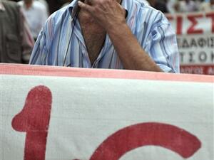 GREECE, Athens : A Greek pensioner demonstrates in front of the Health Ministry and social insurance office in the center of Athens on June 9, 2010 against austerity measures and pension cuts.