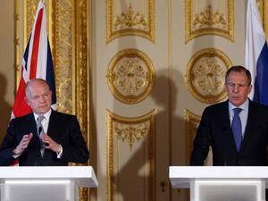 British Foreign Secretary William Hague (L) and his Russian counterpart Sergei Lavrov (R) hold a joint press conference at the Foreign and Commonwealth Office in London. (AFP PHOTO/POOL/OLI SCARFF)