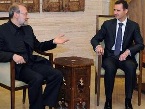 A handout picture released by the Syrian Arab News Agency (SANA) shows Syrian President Bashar al-Assad (R) meeting with Iranian Parliament Speaker Ali Larijani in Damascus. (AFP PHOTO/HO/SANA)