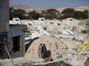 Palestinians laborers work at a housing construction site in the West Bank settlement of Alon, east of Jerusalem on Monday (AFP PHOTO/MENAHEM KAHANA)