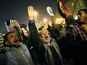An Egyptian opposition supporter shouts political slogans as hundreds of protesters demonstrated against President Mohammed Morsi in Cairo's landmark Tahrir square on Tuesday. (AFP PHOTO/MAHMOUD KHALED)