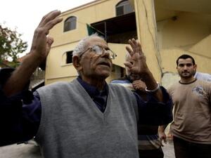 The family of Mohammed Adnan, a suspect in the bombing of the Iranian embassy in Beirut, have disavowed the alleged suicide bomber along with the Palestinian leadership. Here, his grandfather reacts in front of the building where his family lives (AFP)