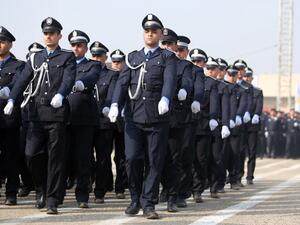 Iraqi policemen march during a ceremony marking police forces 92nd anniversary in the capital Baghdad on January 9, 2014. [AFP]