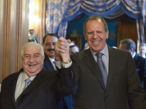 Russian Foreign Minister Sergei Lavrov (R) greets Syrian Foreign Minister Walid al-Moallem in Moscow, on January 17, 2014 during their meeting. [AFP]