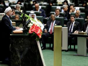 Iran's President Hasan Rowhani (L) delivers a speech after being sworn in before parliament in Tehran on August 4, 2013. (AFP)