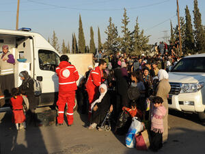Red Crescent workers evacuated starving residents from Damascus suburbs earlier this year (File Archive/AFP)