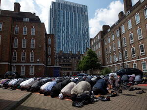 Muslims attend Friday prayers in the sunshine at the BBC Community Centre in the Spitalfields area, London, England (Getty)