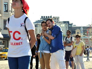  People stand during a silent protest at Taksim Square on June 23 (Getty)