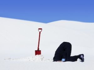 An Emirati man hides two barrels of hashish in the sand. Getty image
