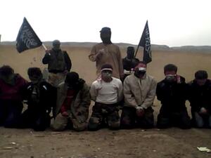 A screenshot from the video in which Al Nusra fighters execute men in rural Syria. Acts such as this have lead the US to call its leader Mohammad Al Golani a terrorist. AFP/YouTube image. 