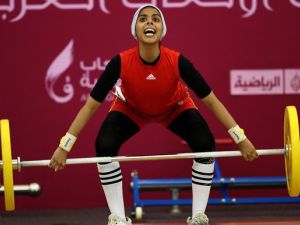 Noof Omar of Yemen attempts the women's 53 kg! (Image courtesy of "newsobserver.com") Noof Omar of Yemen attempts the women's 53 kg! (Image courtesy of "newsobserver.com")