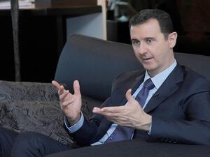 Syrian President Bashar Assad said he will not surrender Syria's chemical weapon stockpiles unless the US stops threatening to launch a strike against the country. (AFP)