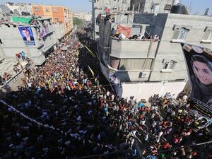 Fans wait for the arrival of Palestinian "Arab Idol" Mohammed Assaf in front his home in Khan Yunis town in the southern Gaza Strip on Tuesday (AFP)