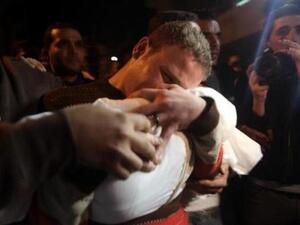 BBC cameraman, Jihad Misharawi cradles dead son, Omar