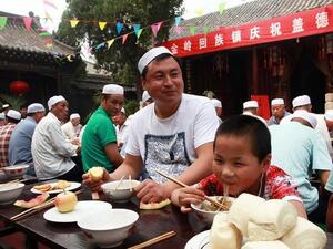 China is home to thousands of Muslims - some estimate that 1-2% of the population believe in Islam. Here, a Chinese Muslim and his son celebrate the first day of Eid Al Adha in 2013 in the east of China. (AFP/File)