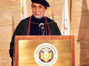 Dean Ilker Baybars addressing students at the ceremony