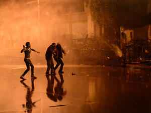 Egyptian police fired a water cannon at stone-throwing protesters outside the presidential palace on Monday as the opposition held rallies to mark the second anniversary of Hosni Mubarak’s overthrow. (AFP)