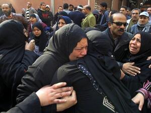 Egyptian women mourn at a morgue in Cairo.