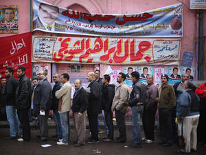 Egyptians voters waiting in line outside a polling station.  Egyptians voters waiting in line outside a polling station.