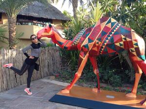 Eva Longoria loves on a camel in Dubai (Image: Facebook)