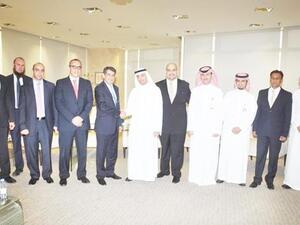 Emile Habib of Gulf Related with Yasir Abu Sulayman of NCB and senior executives. Emile Habib of Gulf Related with Yasir Abu Sulayman of NCB and senior executives.