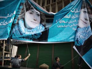 A banner for parliamentary candidate Gamila Ismail near Tahrir Square. A banner for parliamentary candidate Gamila Ismail near Tahrir Square.