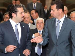 Former Lebanon Prime Minister Saad Hariri with Syrian President Bashar al-Assad.
