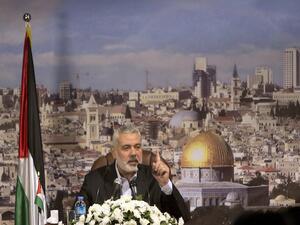 Hamas Prime Minister in the Gaza Strip Ismail Haniya gives a policy statement in a televised address in Gaza City on October 19, 2013. (AFP)