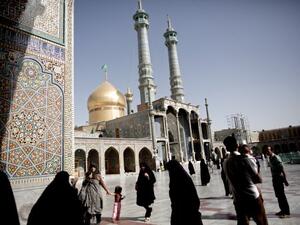 Pilgrims walk across the courtyard of the Massoumeh holy shrine in the religious Shiite Mulsim city of Qom, south of Tehran ahead of the electoral vote on Friday. Iran's powerful bazaar merchants and Shiite clergy spearheaded the 1979 Islamic revolution, but they now play a diminished role in national politics. AFP photo