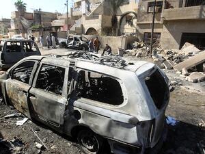 Iraqis inspect the aftermath of a suicide attack in Baghdad's eastern Al Jadidah district, on October 7, 2013. (AFP)