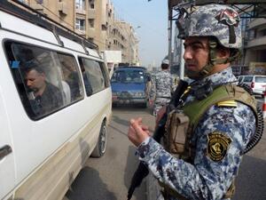 Iraqi interior ministry security forces man a checkpoint in central Baghdad on November 27, 2013 (AFP)